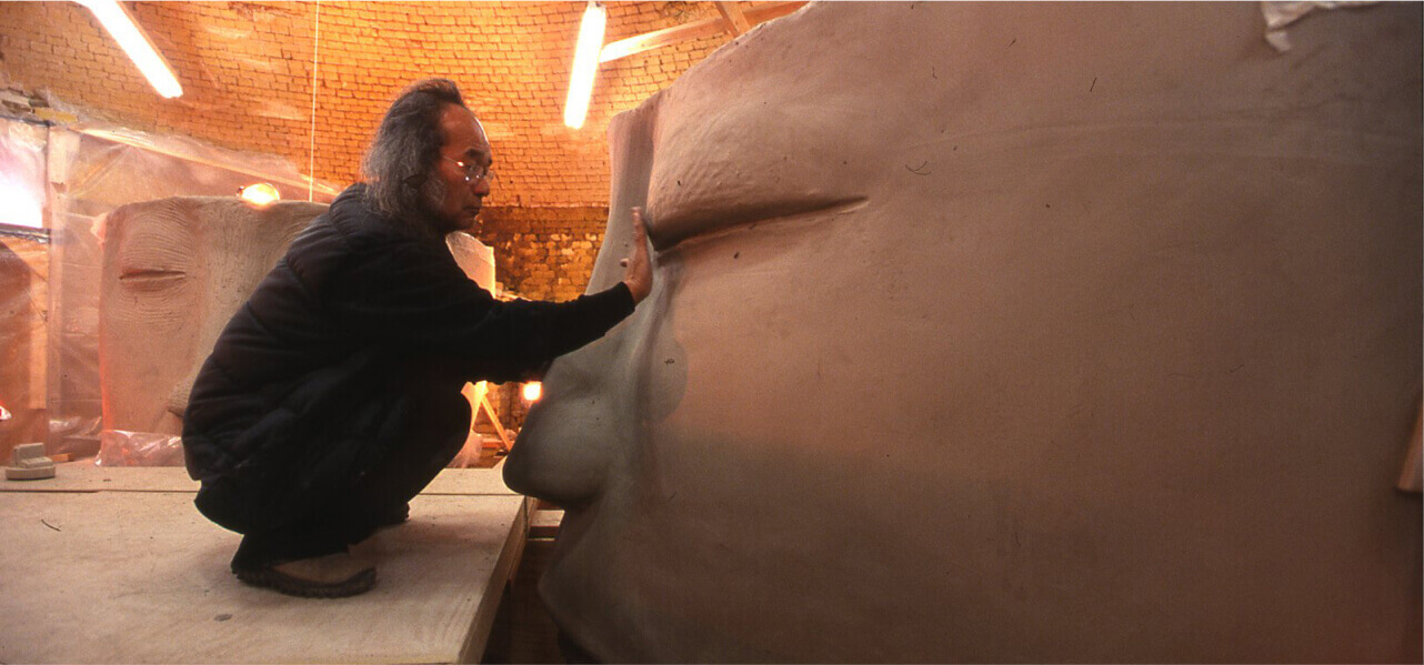 Sculpting heads at Mission Clay Products in Pittsburg, KS, 2007.