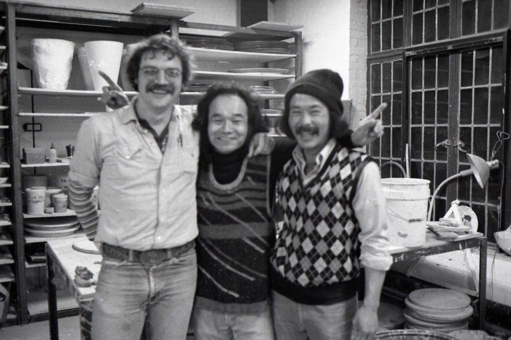Jun Kaneko (center) with Terry Allen (left) and Ken Iwasama in the ceramic studio at Cranbrook Academy of Art, 1980.