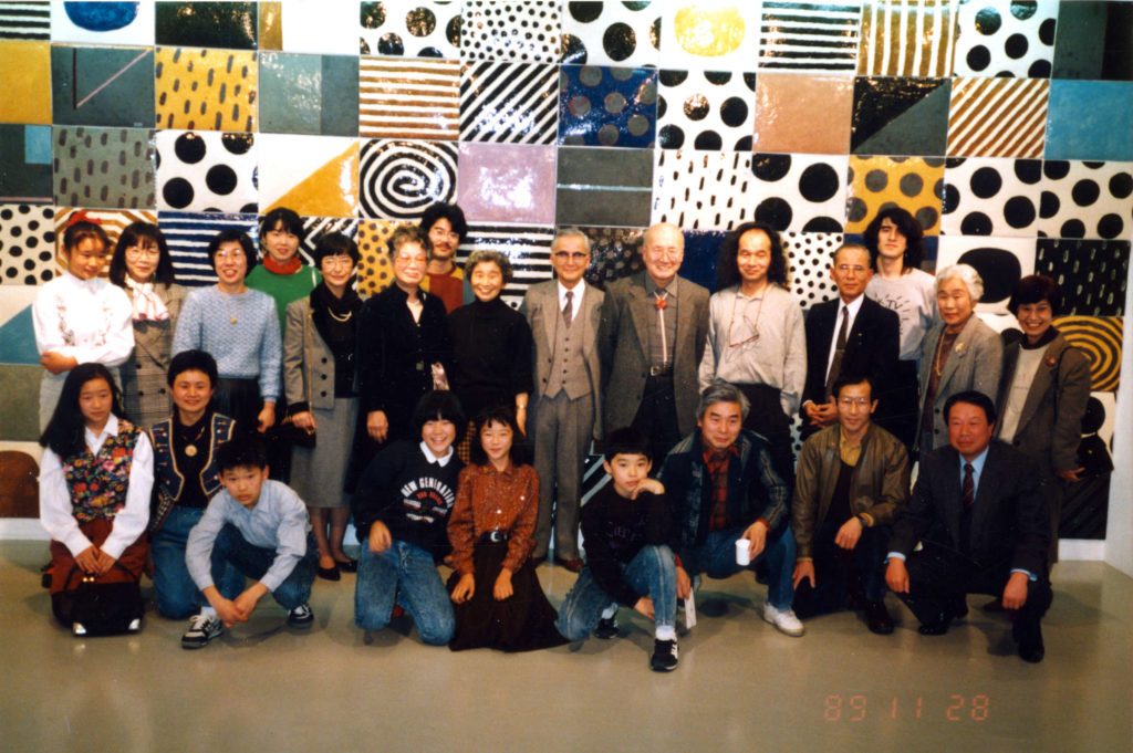 Jun Kaneko with his family in front of Nagoya Wall at an exhibition in Japan.
