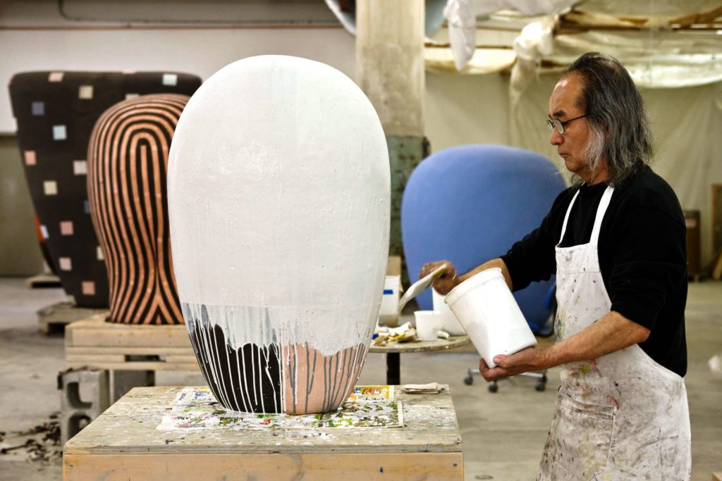 Jun Kaneko in his studio glazing a Dango.