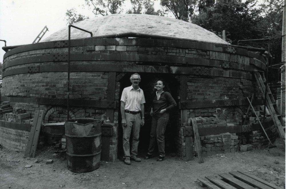 Ree Kaneko with Morrie Cullen, owner of the Omaha Brickworks, outside one of the Brickworks' massive industrial kilns in 1982. Photo courtesy Ree Kaneko.